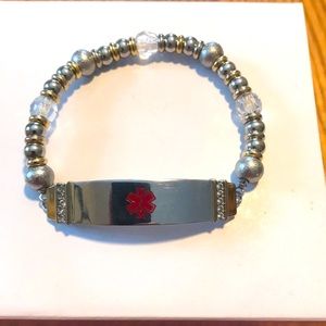 Medic alert bracelet with silver, gold and clear fluted beads
